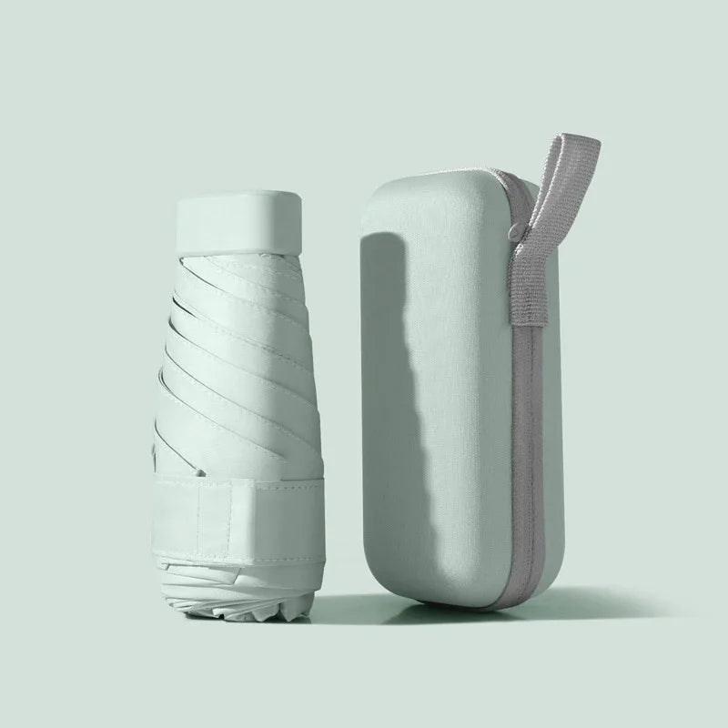 A solid color umbrella with a capsule box and a foldable umbrella for easy travel The umbrella is suitable for both sunny and r