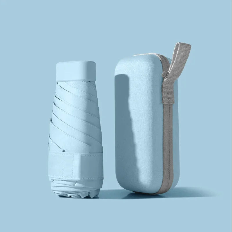 A solid color umbrella with a capsule box and a foldable umbrella for easy travel The umbrella is suitable for both sunny and r