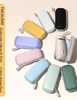 A solid color umbrella with a capsule box and a foldable umbrella for easy travel The umbrella is suitable for both sunny and r