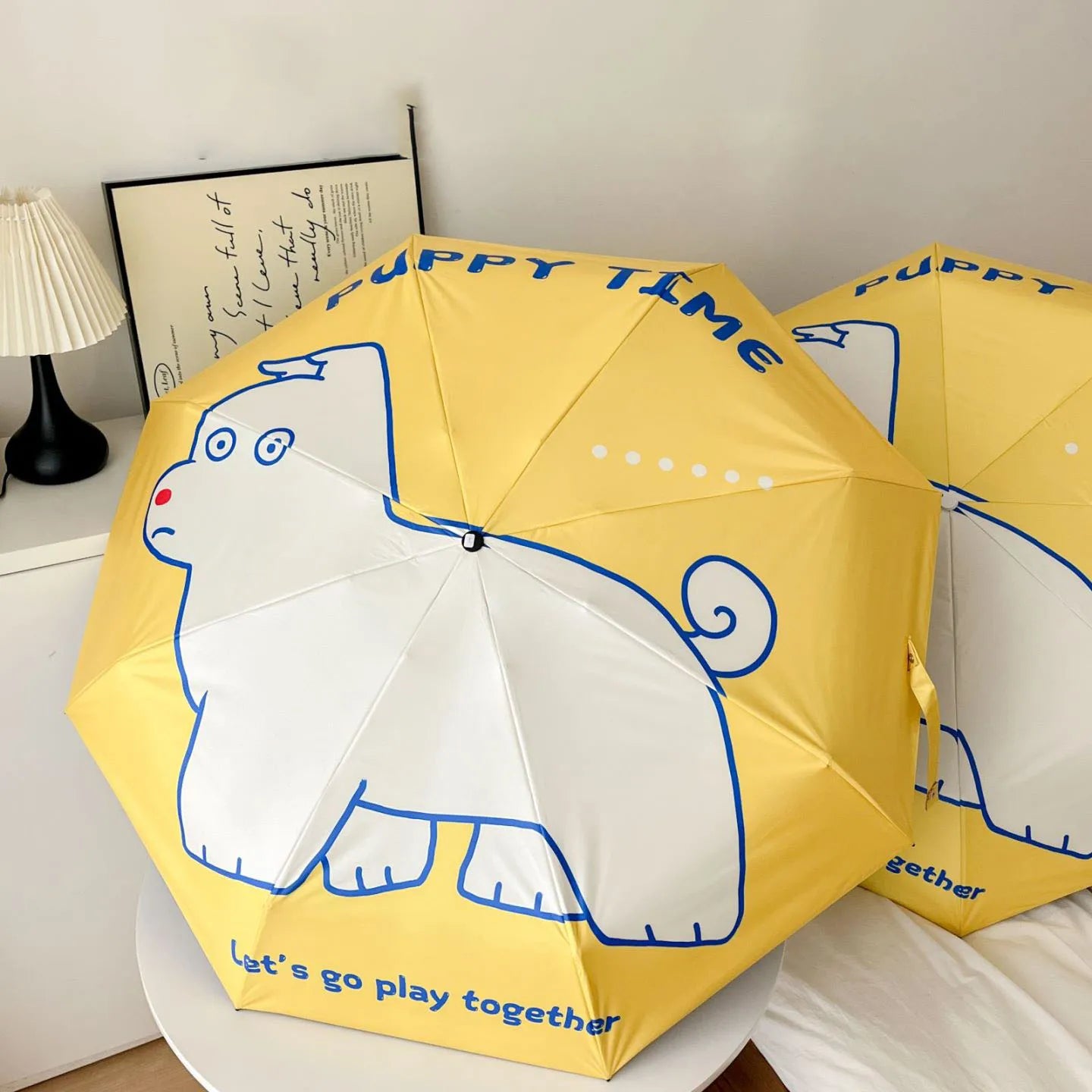 An outdoor travel umbrella with dog prints, mini sun umbrella, sun protection and UV protection