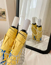 An outdoor travel umbrella with dog prints, mini sun umbrella, sun protection and UV protection