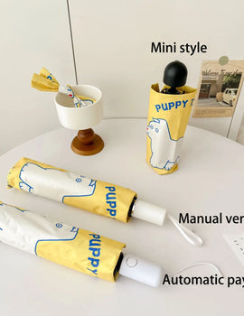 An outdoor travel umbrella with dog prints, mini sun umbrella, sun protection and UV protection