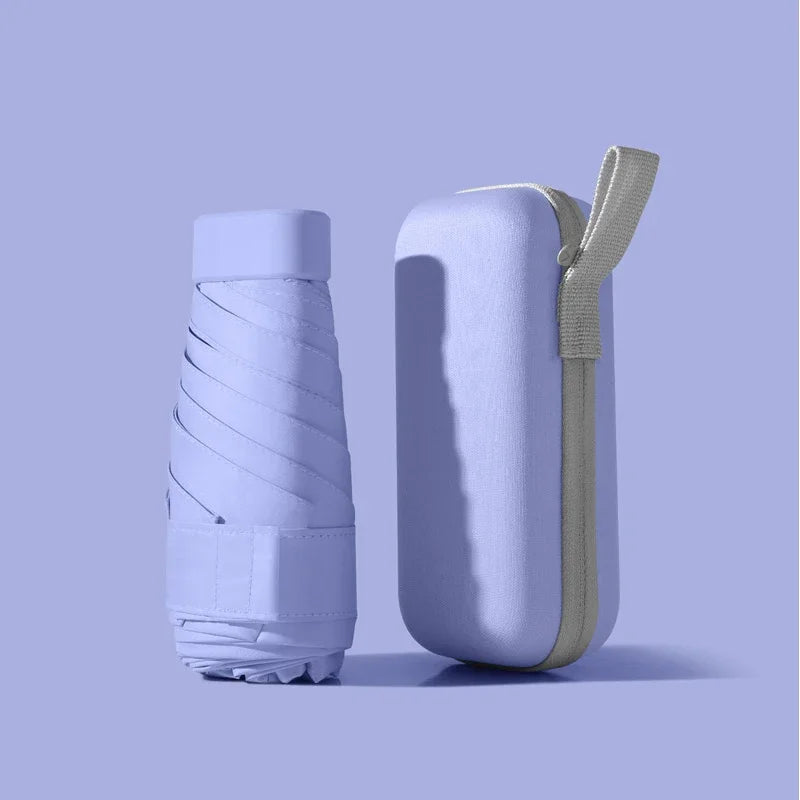 A solid color umbrella with a capsule box and a foldable umbrella for easy travel The umbrella is suitable for both sunny and r