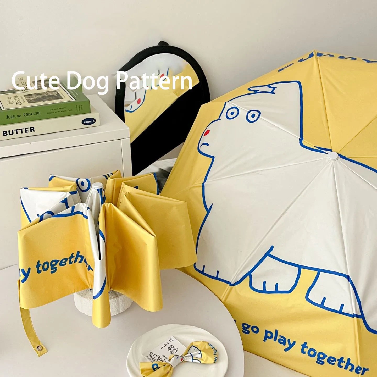 An outdoor travel umbrella with dog prints, mini sun umbrella, sun protection and UV protection