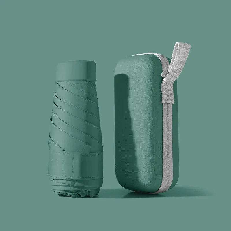 A solid color umbrella with a capsule box and a foldable umbrella for easy travel The umbrella is suitable for both sunny and r