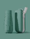 A solid color umbrella with a capsule box and a foldable umbrella for easy travel The umbrella is suitable for both sunny and r