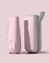 A solid color umbrella with a capsule box and a foldable umbrella for easy travel The umbrella is suitable for both sunny and r